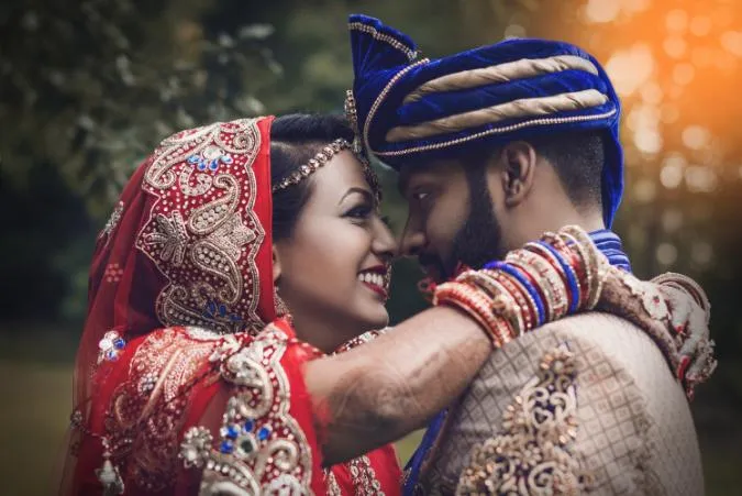 happy couple posing for wedding photography in uk