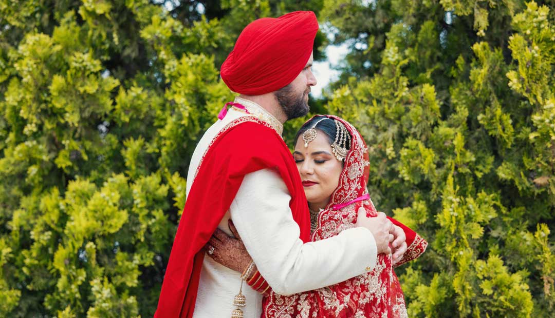 Sikh wedding photoshoot Leamington Gurdwara wedding photography & videography birmingham Uk with a bride wearing sunglasses